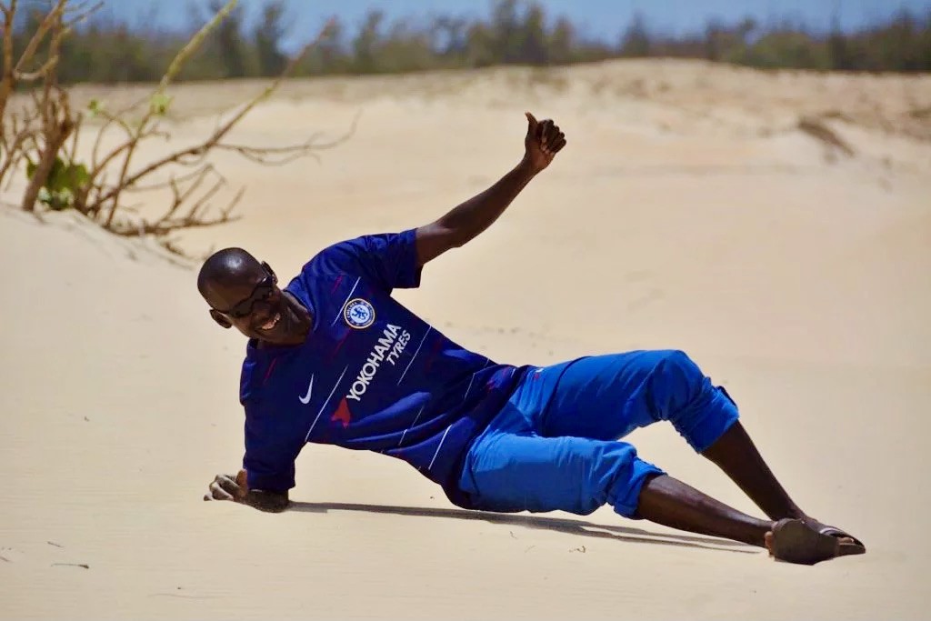 man in Pink lake in Senegal