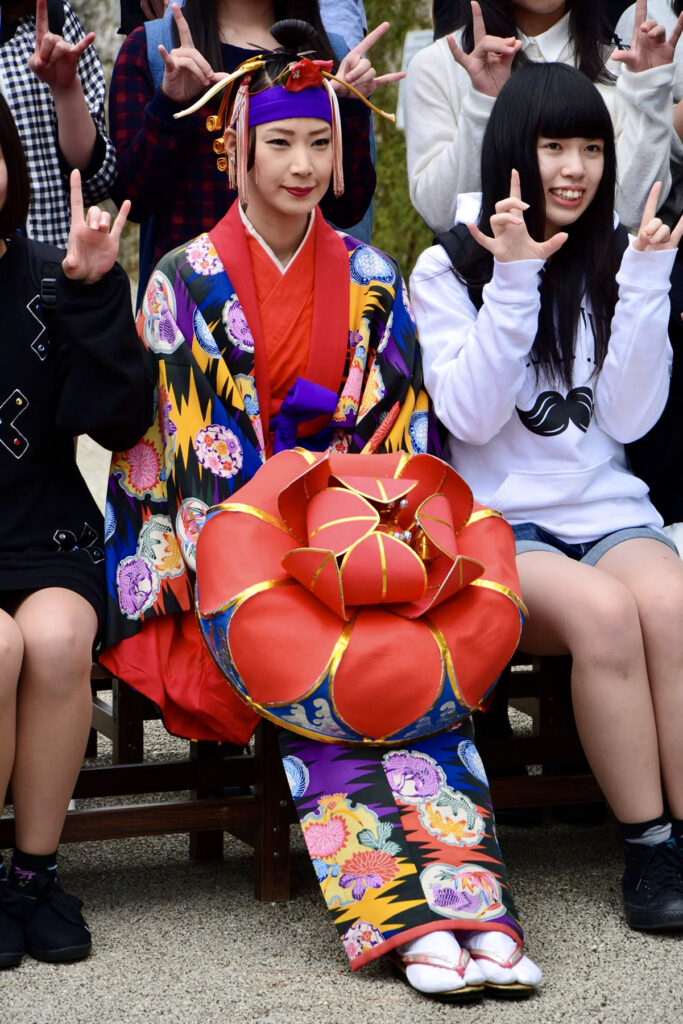 Traditionally dressed woman posing to photo