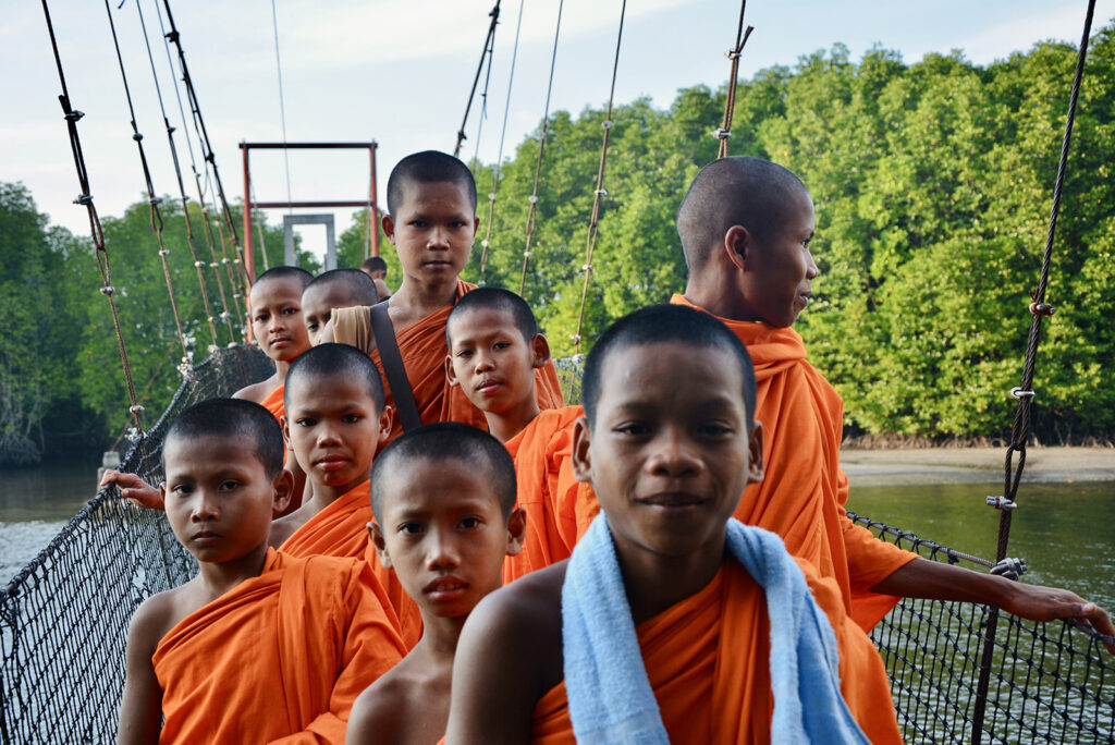 Boy monks on a bridge