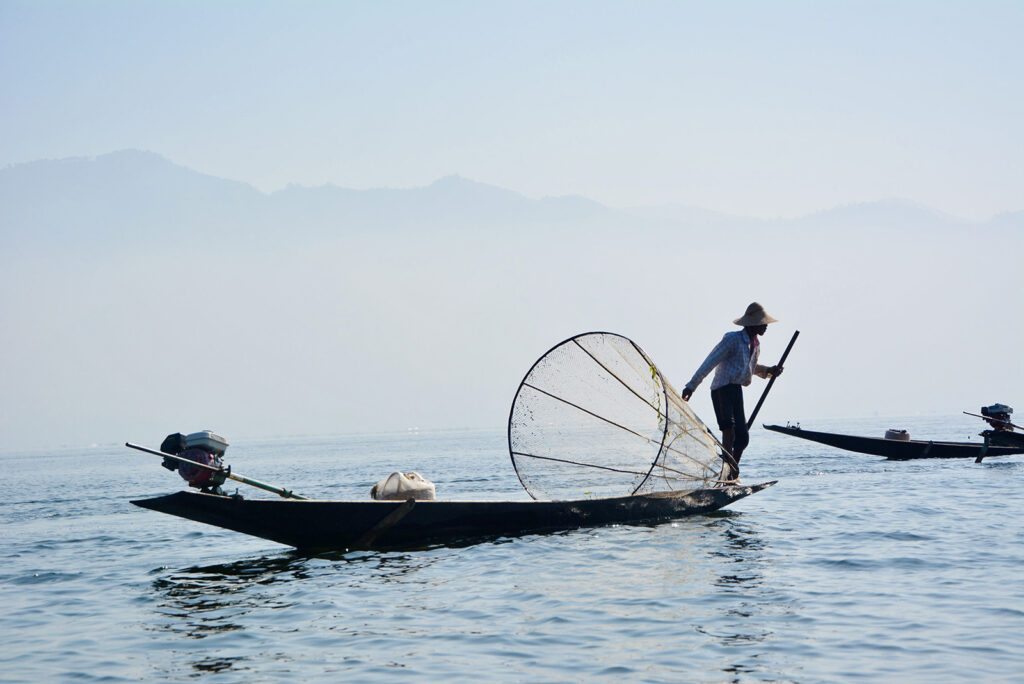 Fisherman catching fish on Inle lake